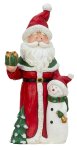Santa standing with present in hand &