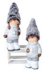 Winterchildren with fabric hat standing
