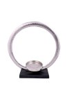 Metal sculpture ring on base as