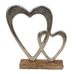 Metal double heart sculptur on wooden