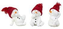 Cute snowman with red hat sitting
