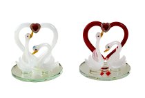 Couple of swans with heart on mirror