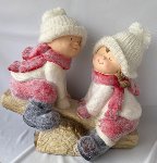 Couple with knitted hat on seesaw h=40cm