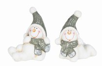 Laughing snowmen lying with scarf and