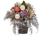 Dried flower arrangement in metal pot