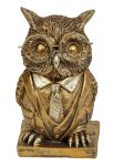 Funny owl in gold with big glasses