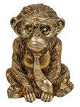 Funny monkey in gold with big glasses