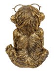 Funny monkey in gold with big glasses