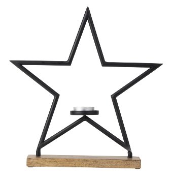 Metal star with candle holder on wooden