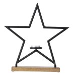 Metal star with candle holder on wooden