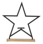 Metal star with candle holder on wooden