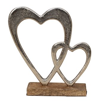 Metal double heart sculptur on wooden