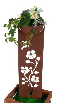 Rusty metal column with bowl as garden