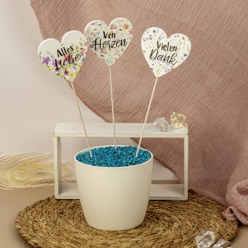 wooden hearts with words as flower stick