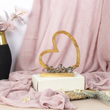Word "Liebe" with heart on wooden base