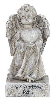 Grabengel mit Herz in der Hand stehend