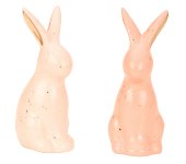 Modern rabbit sitting in terracotta/rose