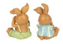 Eastern rabbit sitting with egg & carrot