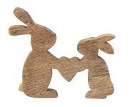 Wooden rabbits with holding heart in