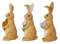 Rabbit standing with flower, eggs and