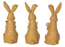 Rabbit standing with flower, eggs and