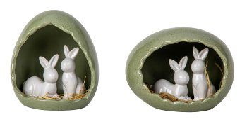 Kleine Weiße Osterhasen in Osterei-Nest
