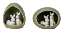Kleine Weiße Osterhasen in Osterei-Nest