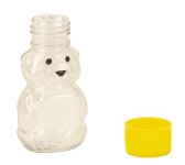 Plastic bear bottle with yellow lid